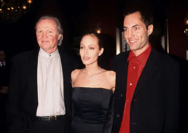 Jon Voight, Angelina Jolie and James Haven standing together at an event