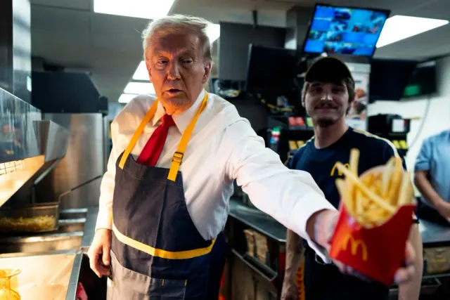Donald Trump behind the counter during his October 2024 McDonald’s campaign visit