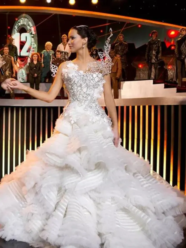 Another view of Jennifer Lawrence as Katniss wearing the ruffled Catching Fire interview gown