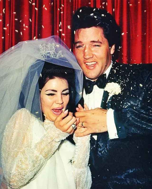 Priscilla and Elvis in their wedding clothes