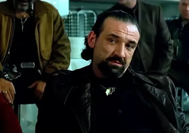 Richie Coster as the Chechen in The Dark Knight