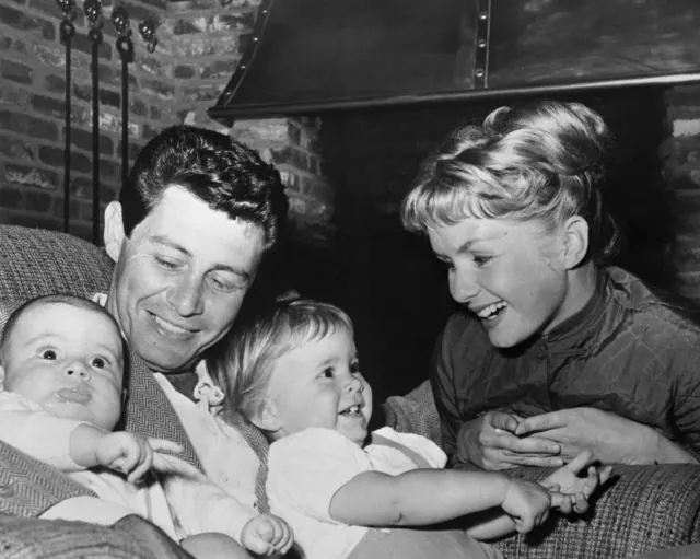 Eddie Fisher and Debbie Reynolds with two young children in an archival family photograph