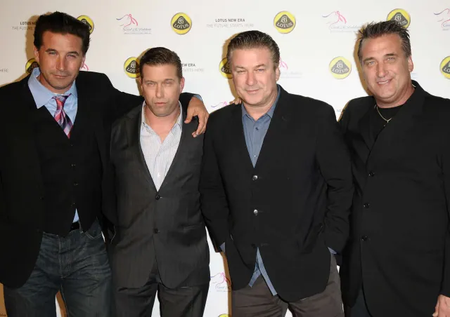 Alec, Daniel, William and Stephen Baldwin standing together in dark jackets