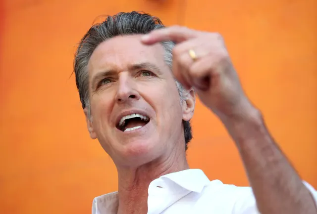 Gavin Newsom speaking at an outdoor event