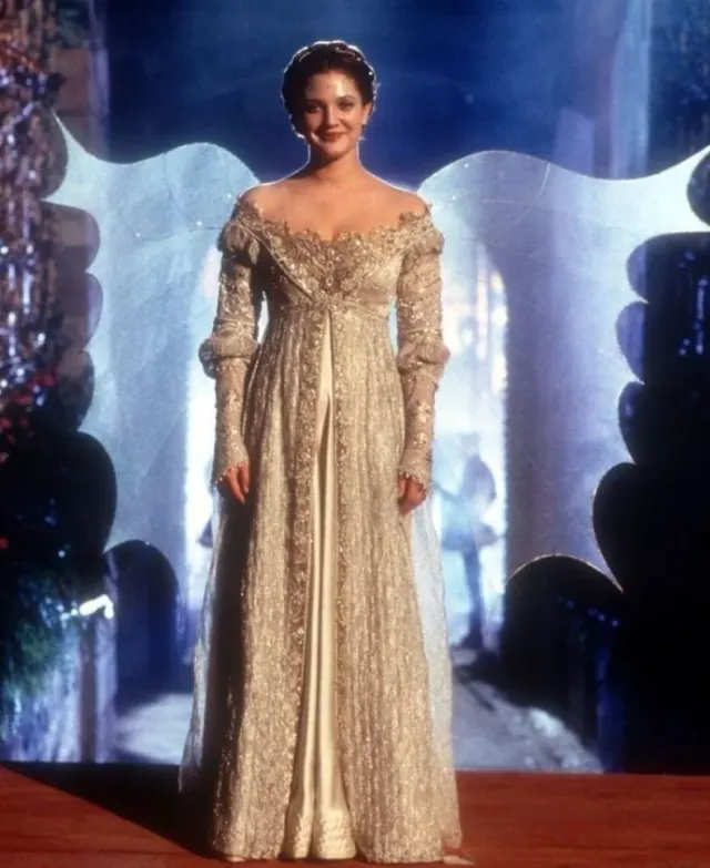 Drew Barrymore as Danielle wearing an embroidered ball gown and fairy wings in Ever After
