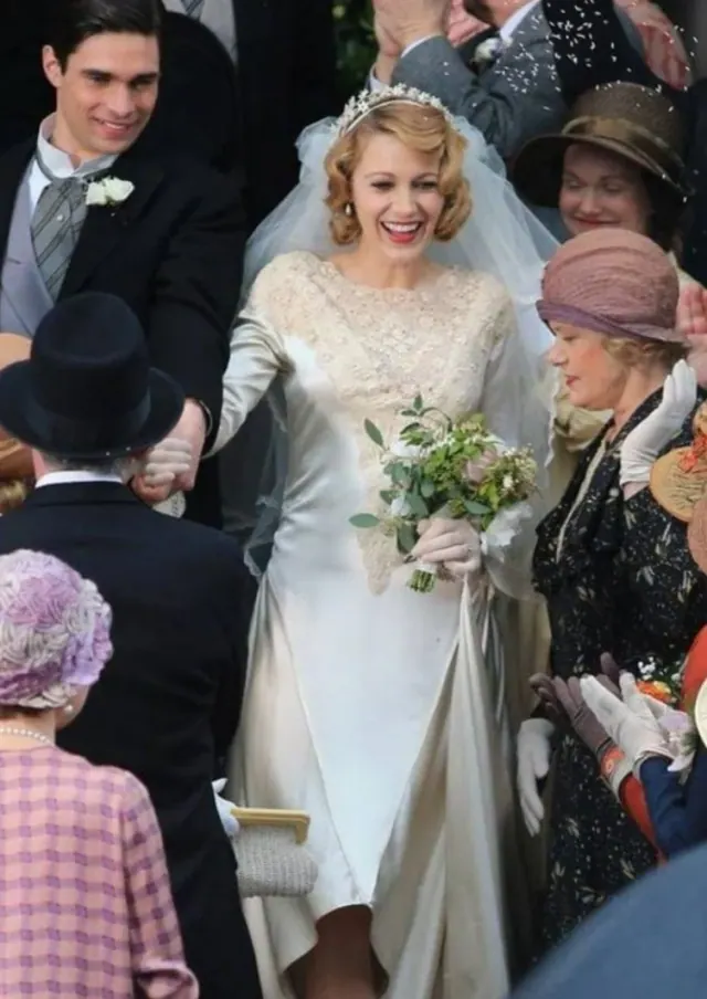 Blake Lively as Adaline in a long-sleeved wedding dress among seated guests