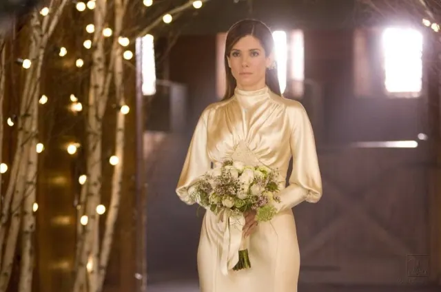 Sandra Bullock as Margaret in a high-necked vintage-style bridal gown