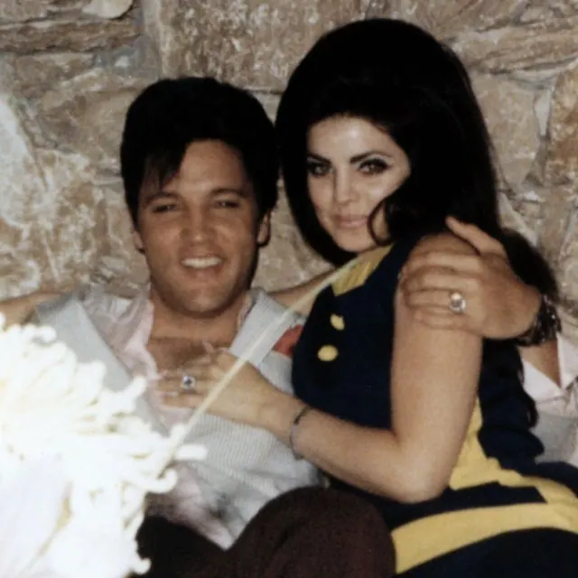 Priscilla and Elvis seated together
