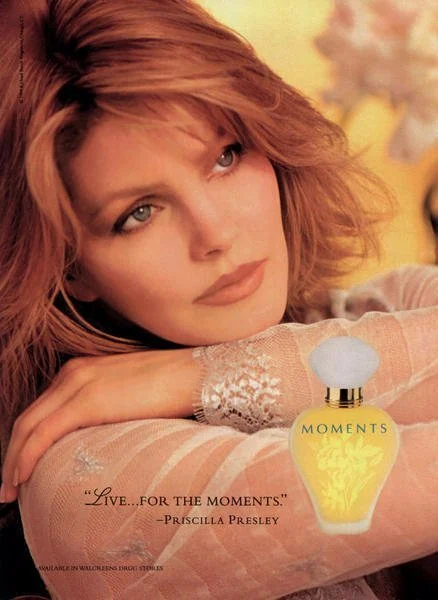 Fragrance advertisement showing Priscilla beside a yellow perfume bottle