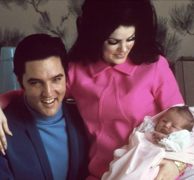Priscilla in a bright pink dress beside Elvis and baby Lisa Marie